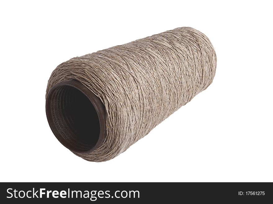 Big bobbin with thread, isolated on a white background