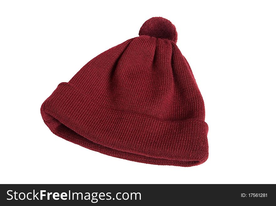 Woolen knitted cap in red on a white background. Woolen knitted cap in red on a white background