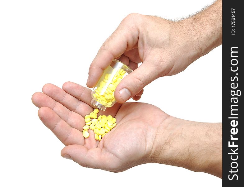 Closeup on man's hands with pills and pill container.