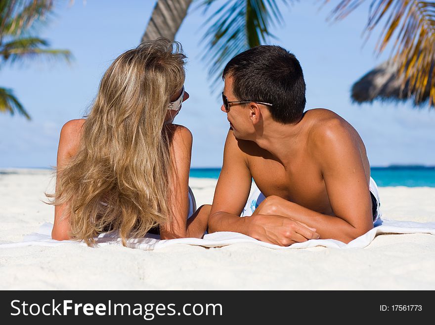 In love young couple on a tropical beach