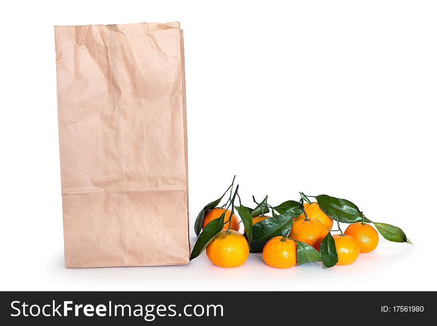 Tangerines and paper shopping bag. Tangerines and paper shopping bag