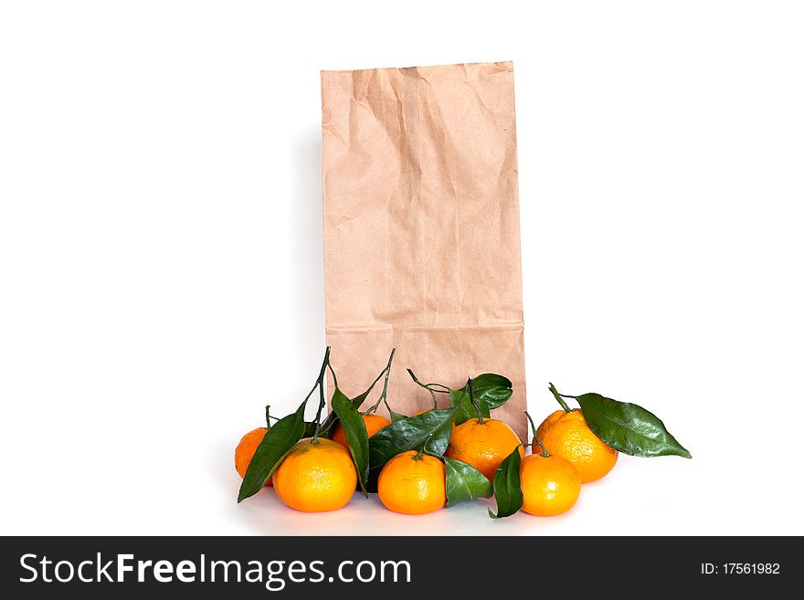 Tangerines with shopping bag isolated on white