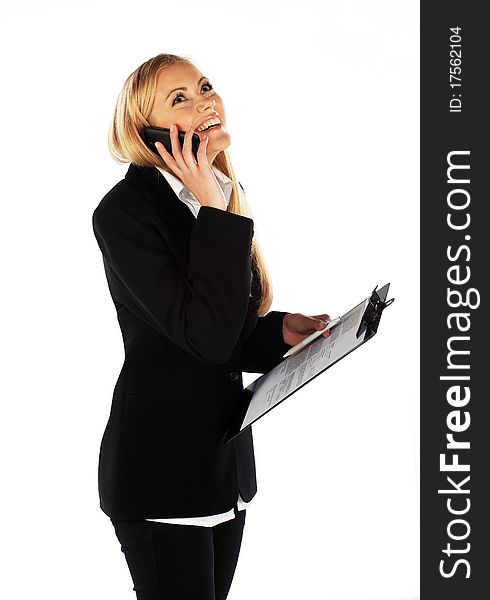 Business girl smiling and talking on mobile phone. Business girl smiling and talking on mobile phone