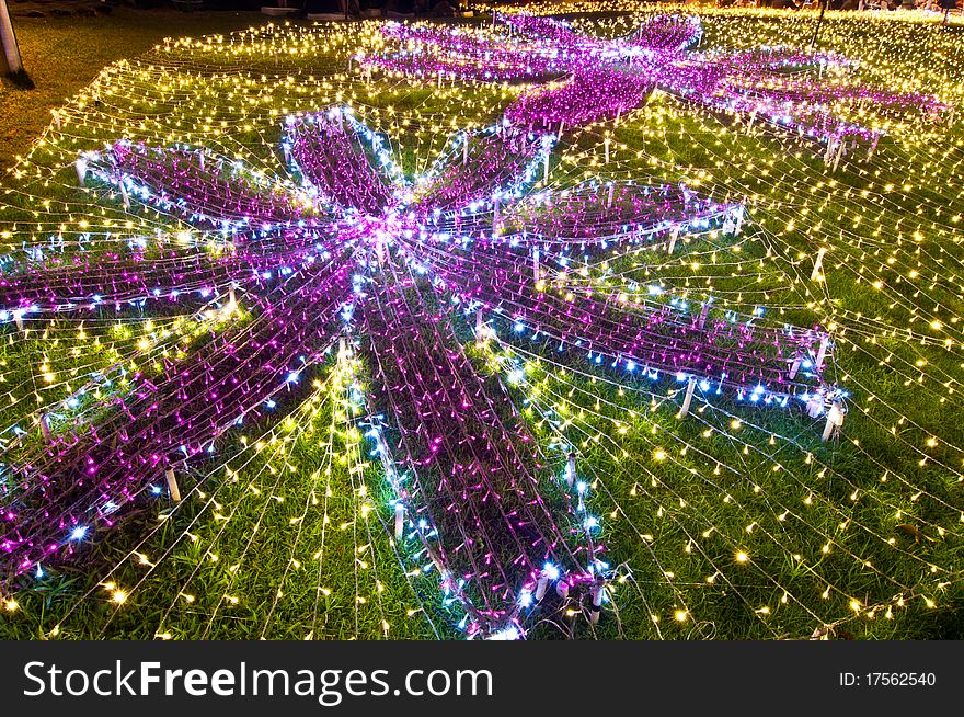 Beautiful violet flowers made from small lamps, Thailand.