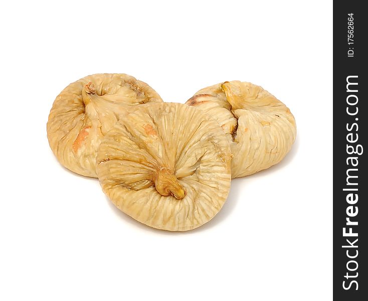 Three dried figs isolated on a white background. Three dried figs isolated on a white background