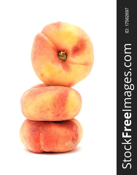 Flat peaches isolated on a white background