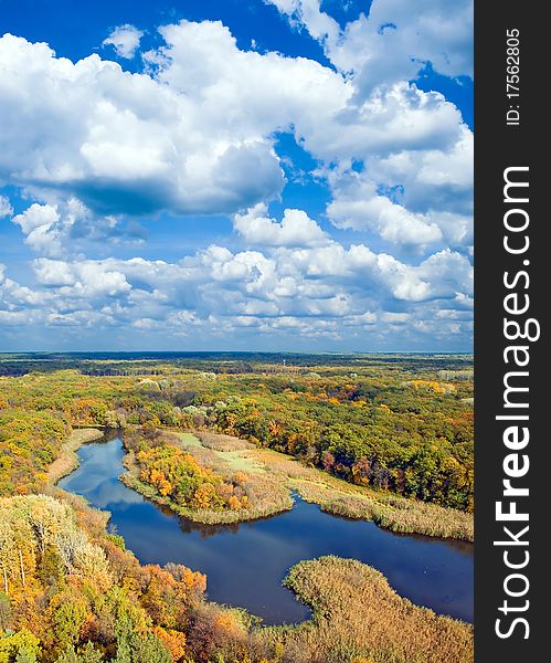 Autumnal forest, river and sky (view from above). Autumnal forest, river and sky (view from above).