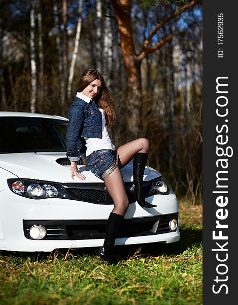 Young Stylish Woman And White Power Car