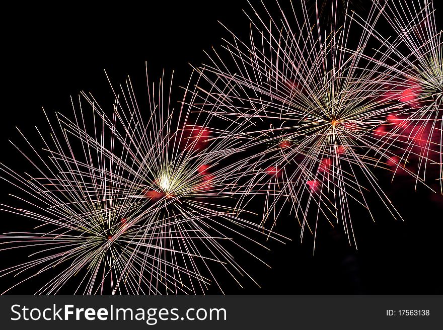 Colorful Fireworks display with copy space left or right.
