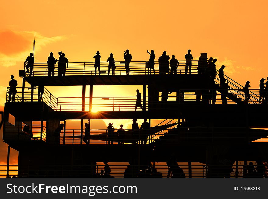 Sunset silhouette of peoples at view point. Sunset silhouette of peoples at view point.