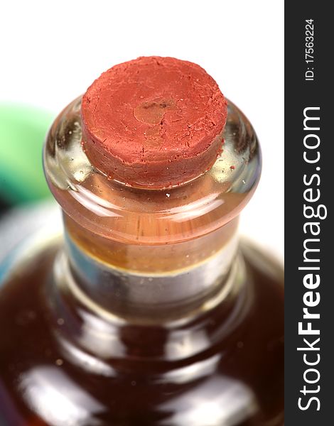 Closeup shot of cork stuck in oil bottle mouth.