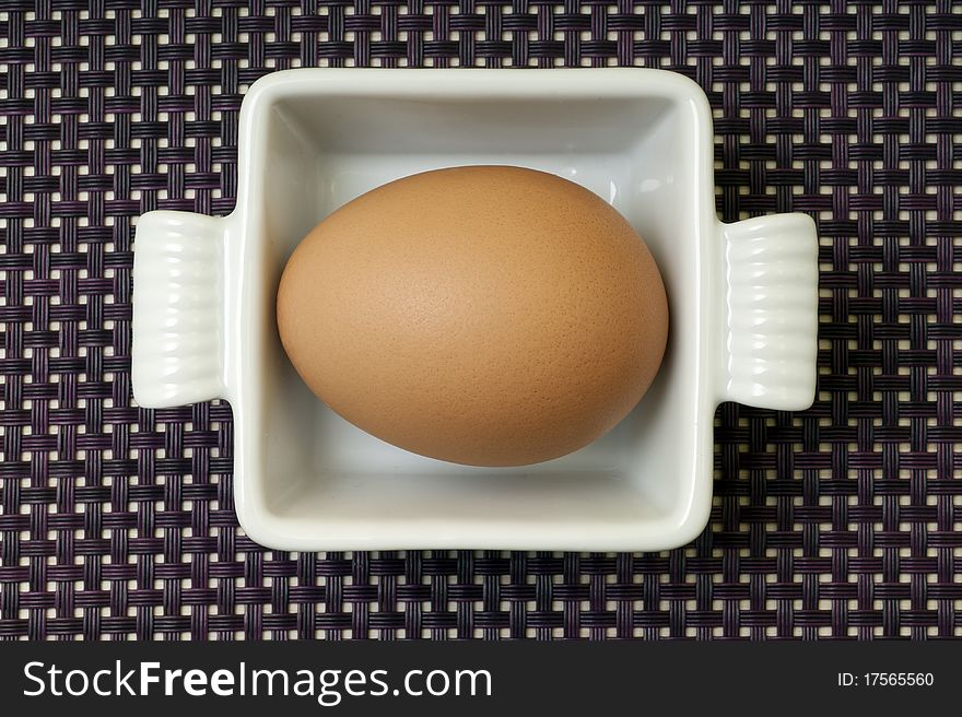 Egg in a ceramic pan. Egg in a ceramic pan