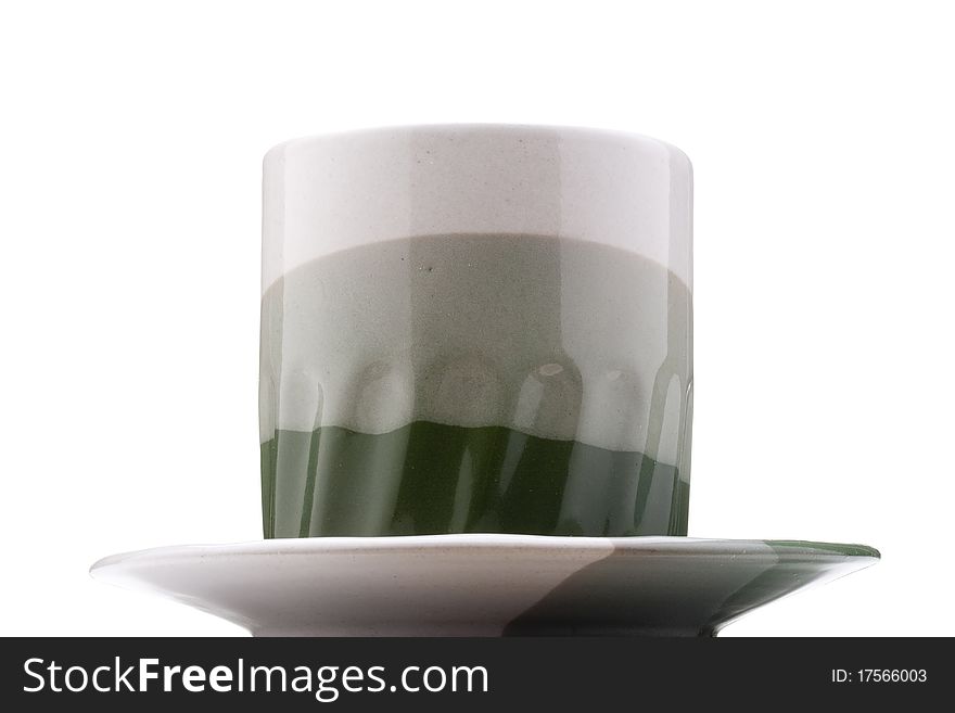 Ceramic mug and saucer with greyish green for hot drinks.