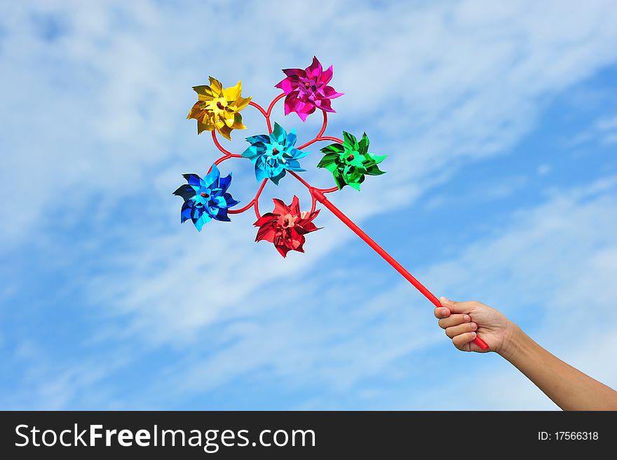 Colorful Multi Pinwheels Against Blue Sky