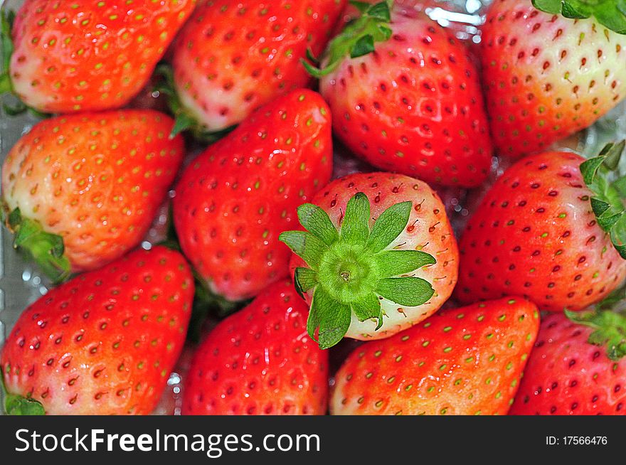 Closeup Of Fresh Strawberries Forming a Background