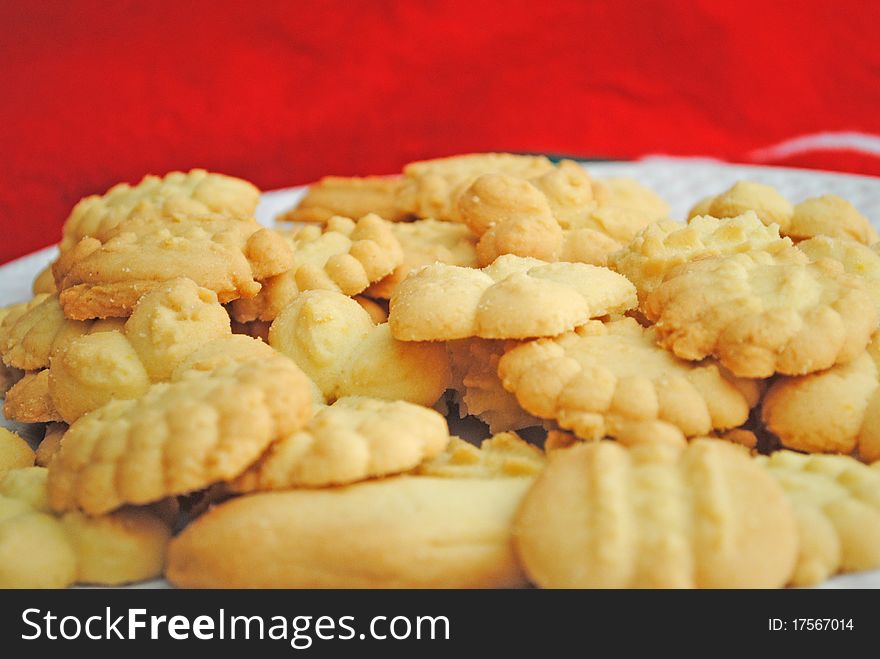 Cookies for the season holidays on a red background. Cookies for the season holidays on a red background