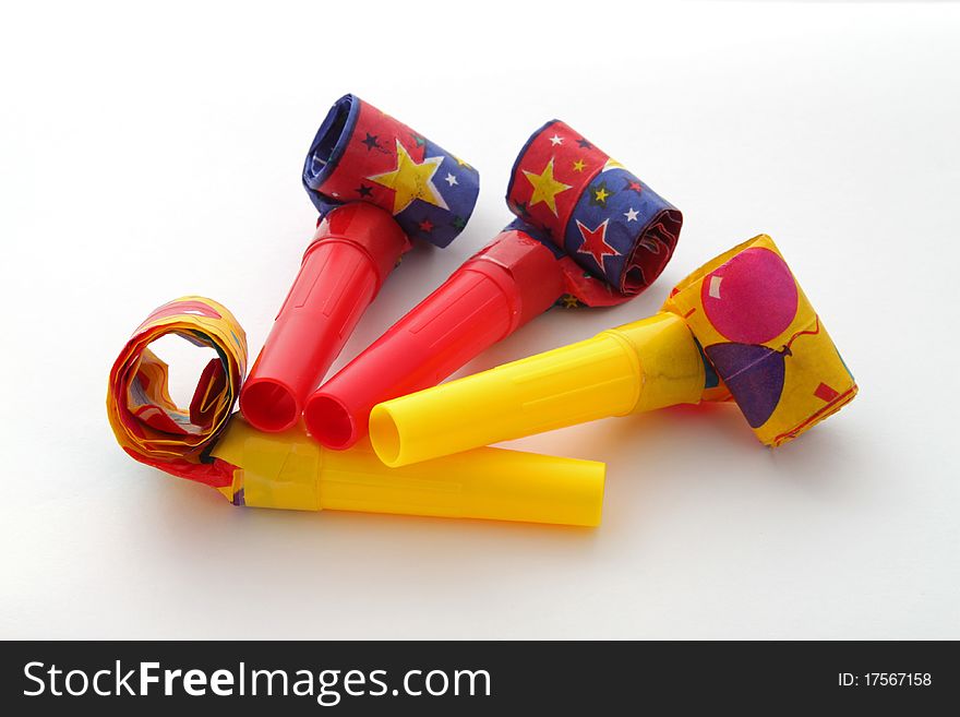 Party blowers on a plain white background.