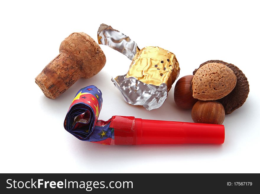 Champagne cork, foil, blower and nuts on a plain white background.