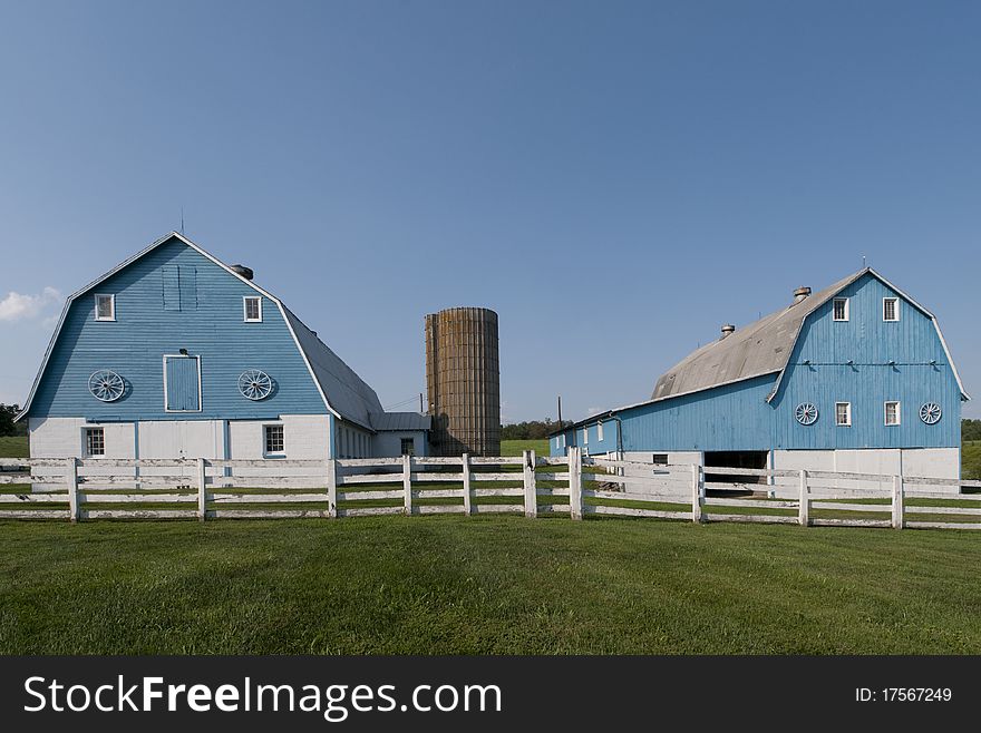 A pair of unusual blue barns in rural Maryland