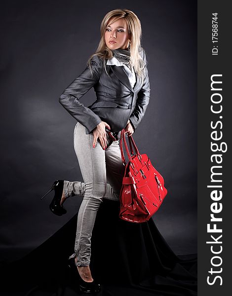 Fashion young woman with red bag