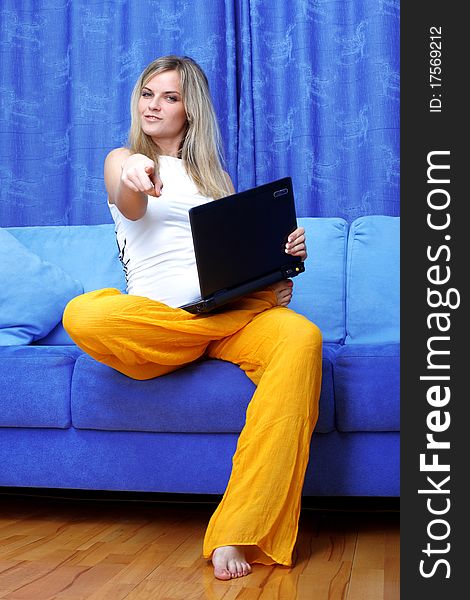 Woman working with PC at home in sofa