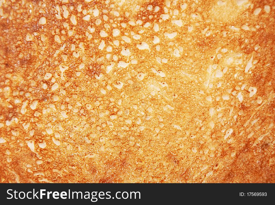 Porous, mesh, yellow pancake texture. Porous, mesh, yellow pancake texture