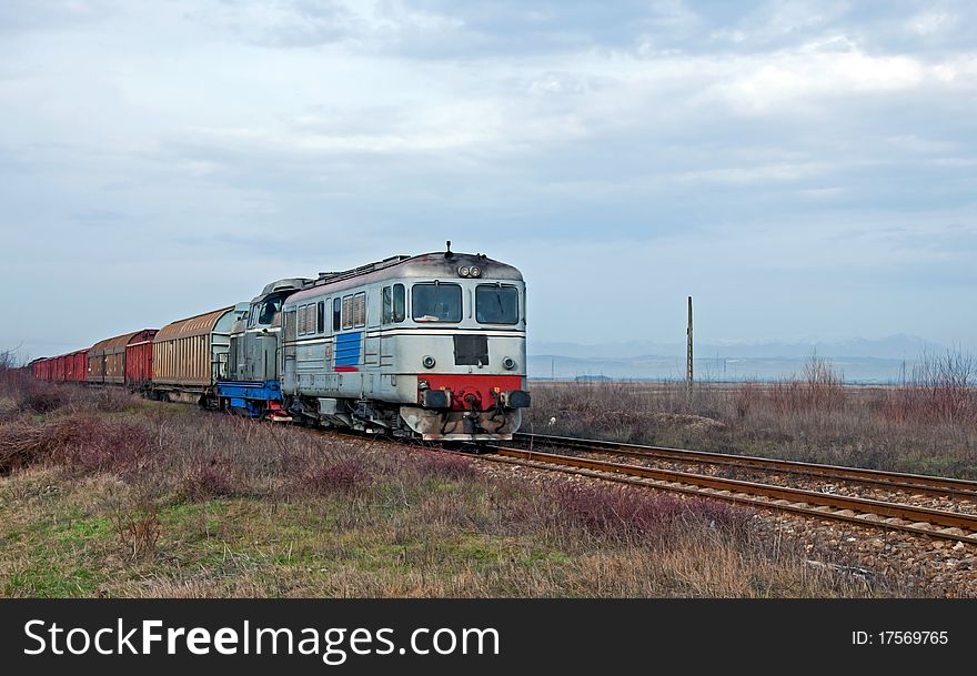 Coming speedy heavy train with two locomotives. Coming speedy heavy train with two locomotives