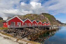 Typical Norwegian Village On The Fjord. Reflection In Water Royalty Free Stock Photo