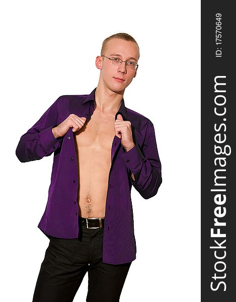 Young man getting off violet shirt. Young man getting off violet shirt