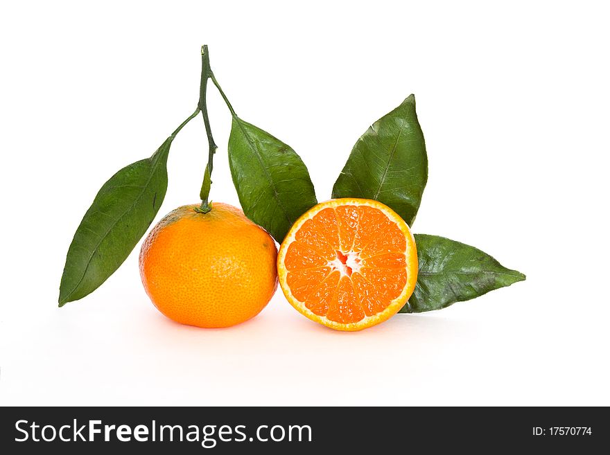 Fresh tangerines with leafs isolated on white