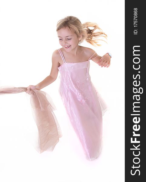 Little girl in fairy dress running in studio