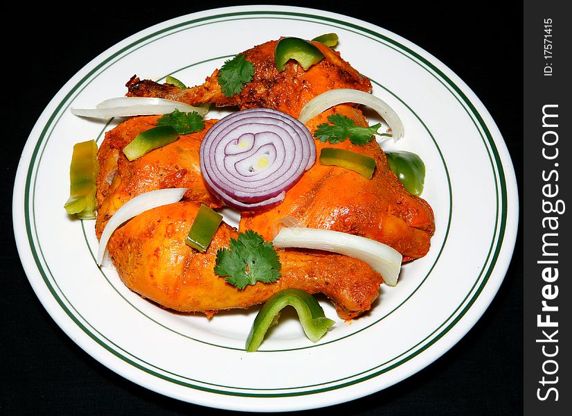 Fresh, hot and spicy tandoori chicken in plate