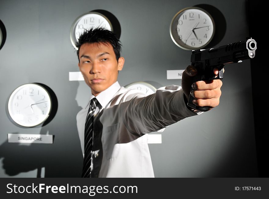 Asian Man with Pistol. He can be a cop or a terrorist, depending on intepretation. Asian Man with Pistol. He can be a cop or a terrorist, depending on intepretation.