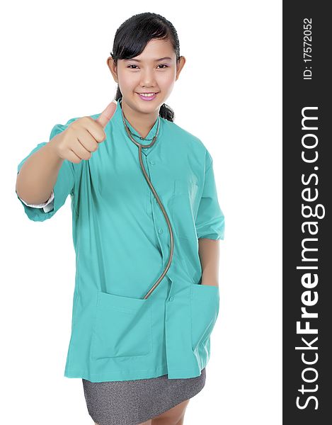 A Doctor wearing scrub show her thumb isolated over white background. A Doctor wearing scrub show her thumb isolated over white background