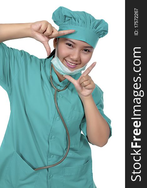 A Doctor wearing scrub , framing her face isolated over white background. A Doctor wearing scrub , framing her face isolated over white background