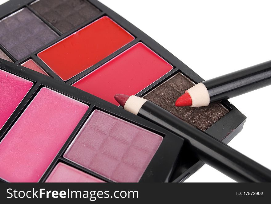 Cosmetics for everyday. Eye-shadow and lipstick isolated on the white background.