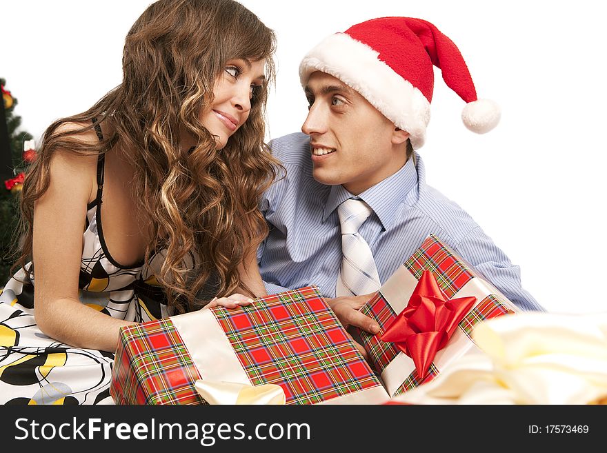 Young lovely couple with gift boxes. Isolated over white background