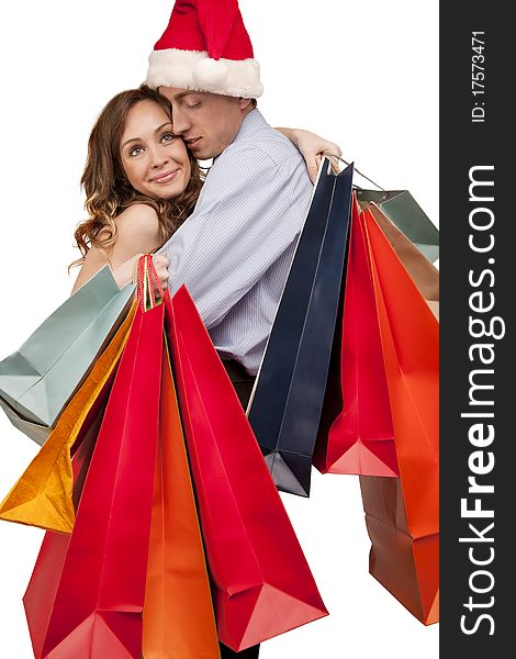 Lovely couple making christmas shopping. Isolated on white.