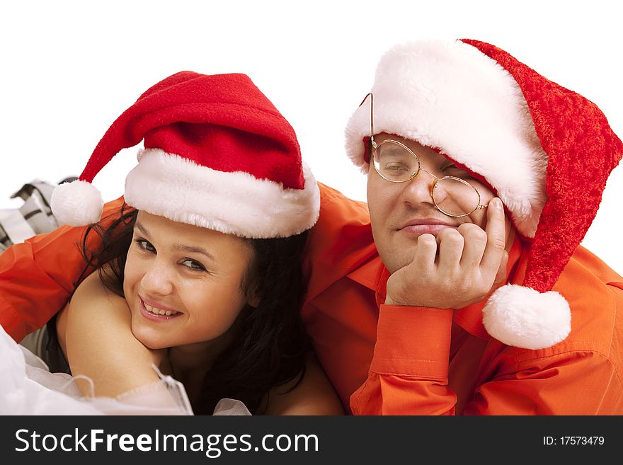 Young lovely Christmas couple. Isolated over white background