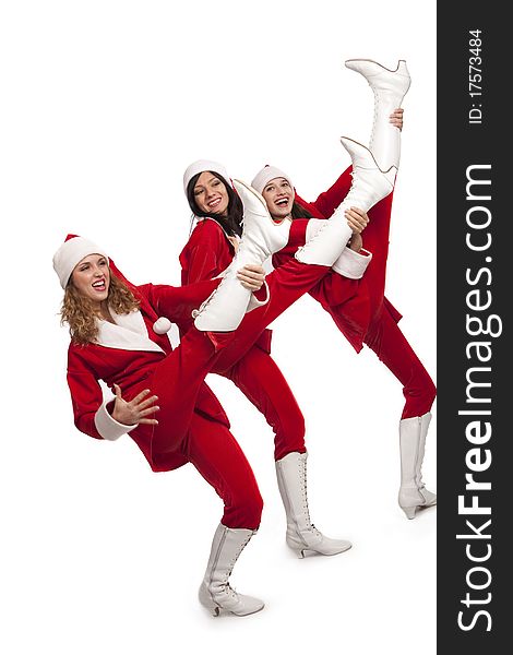 Xmas background: three girls in santa costumes playing on teir legs like on guitars, isolated on white. Xmas background: three girls in santa costumes playing on teir legs like on guitars, isolated on white