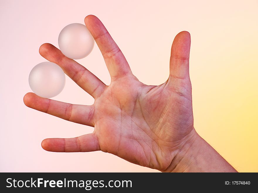 Semi transparent white balls between the fingers