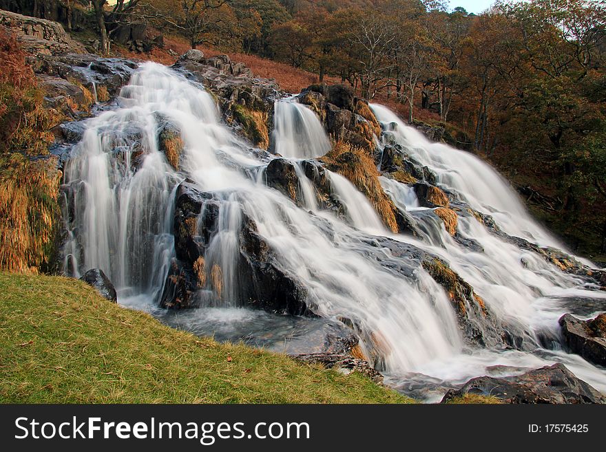 Autumn Falls. Long Exposure image of Afon Cwm Llan Waterfall, by the Watkins Path, Snowdon, Wales. Autumn Falls. Long Exposure image of Afon Cwm Llan Waterfall, by the Watkins Path, Snowdon, Wales