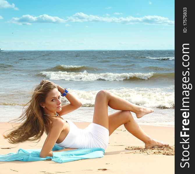 Woman laying on sand sea on background. Woman laying on sand sea on background