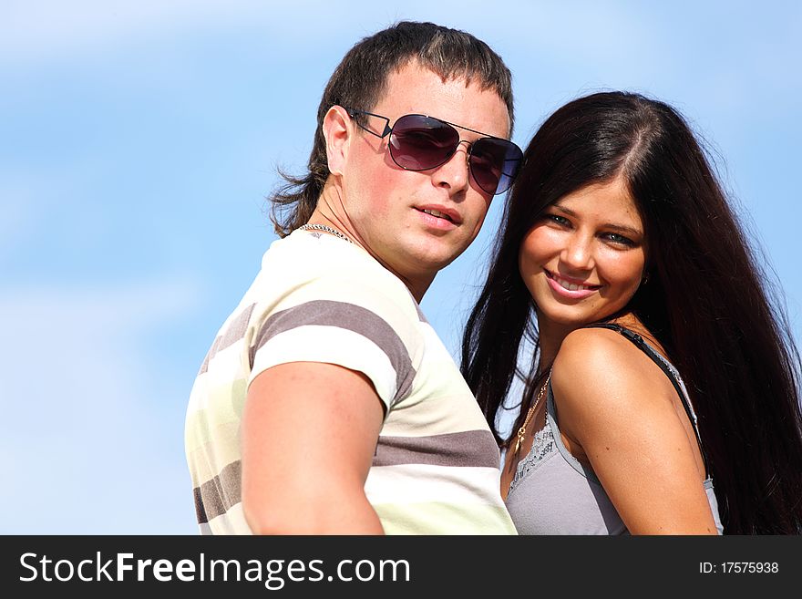 Man and woman hug sky on background. Man and woman hug sky on background