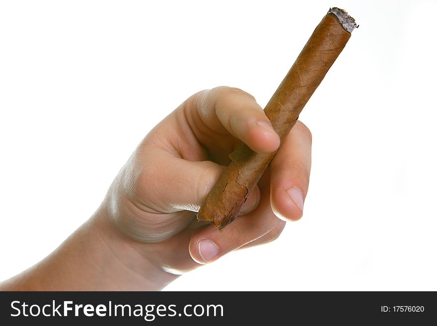 The man's hand holds fingers a cigaret on a white background. The man's hand holds fingers a cigaret on a white background