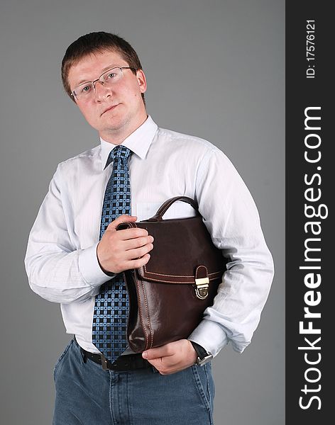 Businessman in white shirt and tie with briefcase. Businessman in white shirt and tie with briefcase