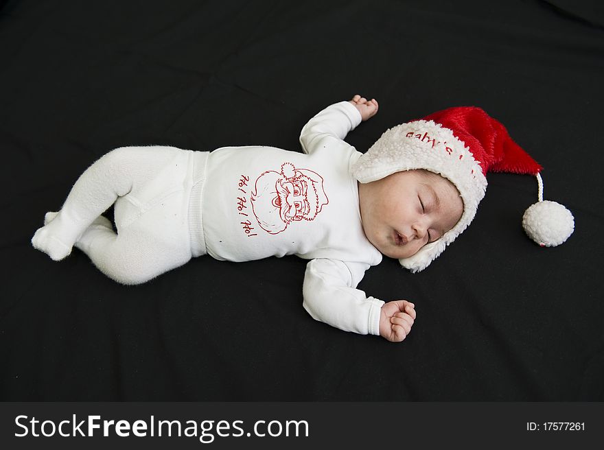 Portrait with little Santa Claus sleeping