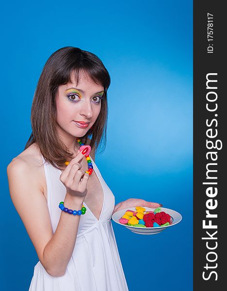 Portrait of beautiful girl holding candies in hands. Portrait of beautiful girl holding candies in hands