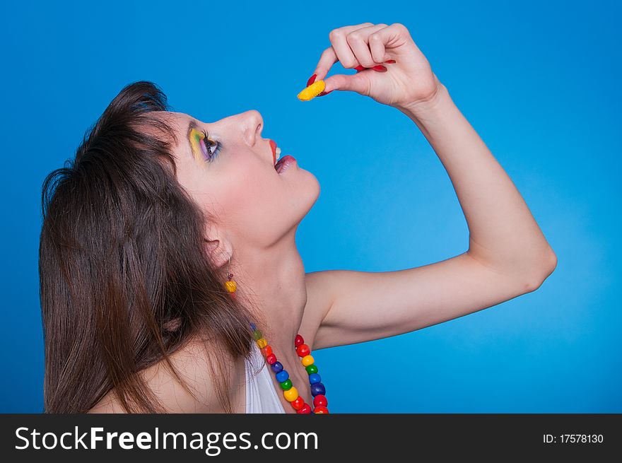 Portrait of beautiful girl with a candy in a hand. Portrait of beautiful girl with a candy in a hand