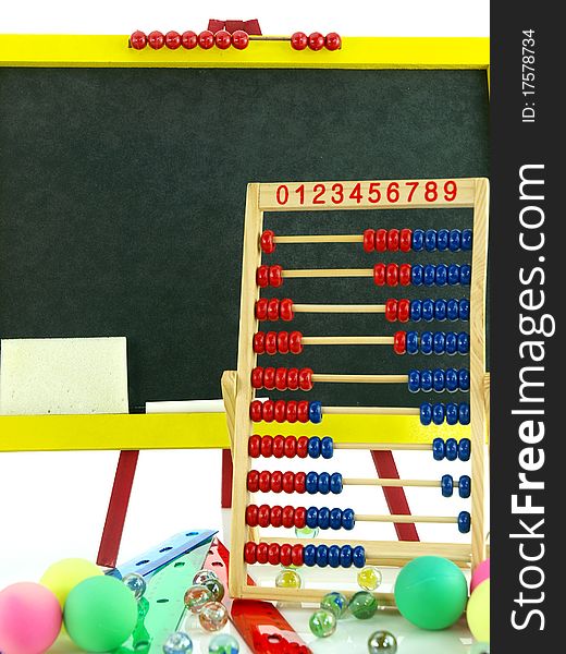 Colorful blackboard with abacus and marbles
